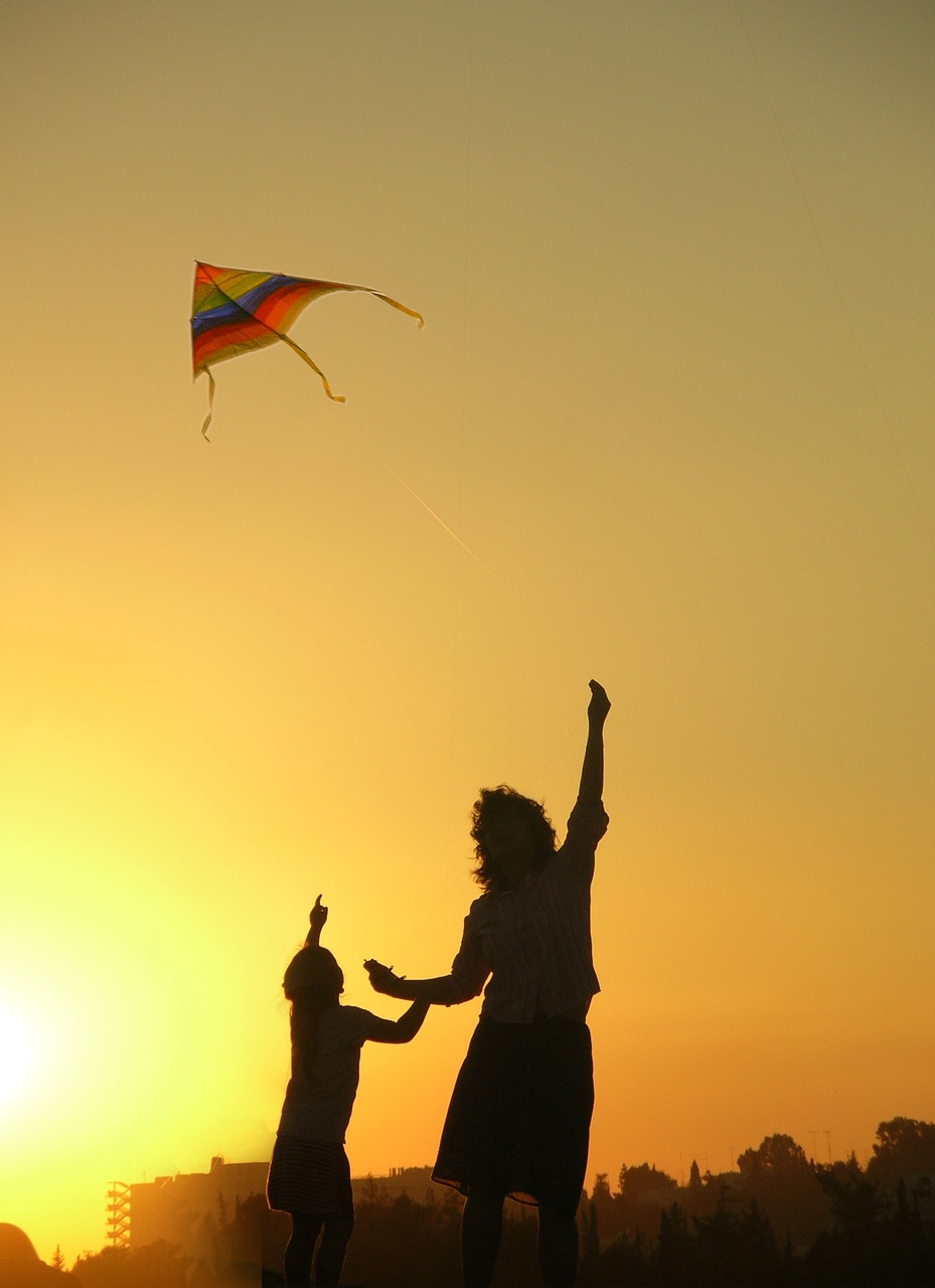 Children playing outdoors — summer social skills